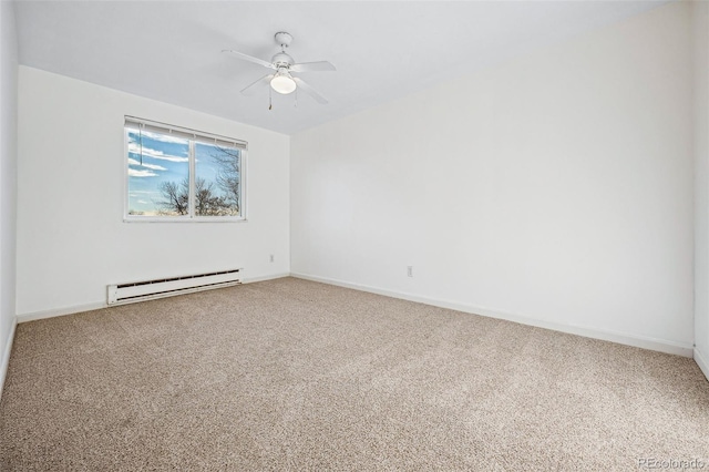 carpeted empty room with ceiling fan and a baseboard radiator