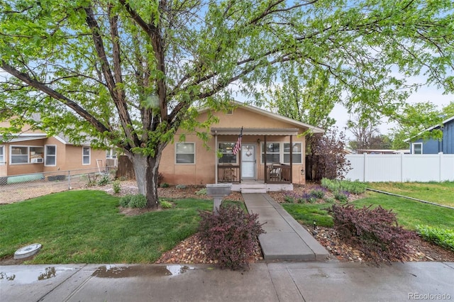 313 E Grant Ave, Fowler, CO 81039 - view of front of house featuring stucco siding and covered porch