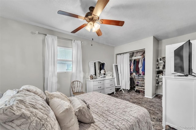 313 E Grant Ave, Fowler, CO 81039 - bedroom with dark colored carpet, a closet, a textured ceiling, and ceiling fan