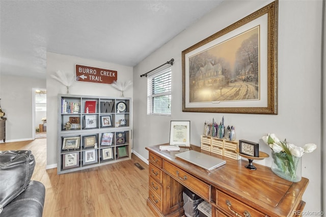 313 E Grant Ave, Fowler, CO 81039 - office area featuring light wood finished floors and baseboards