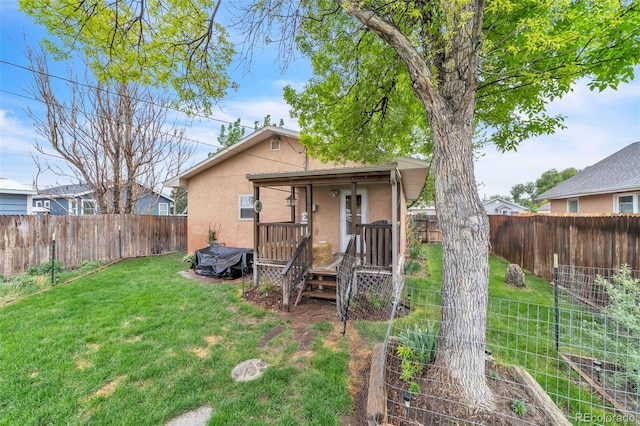 313 E Grant Ave, Fowler, CO 81039 - rear view of house with stucco siding