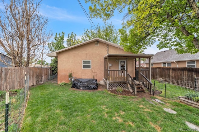 313 E Grant Ave, Fowler, CO 81039 - back of house featuring stucco siding