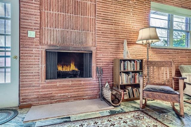 living area with a lit fireplace