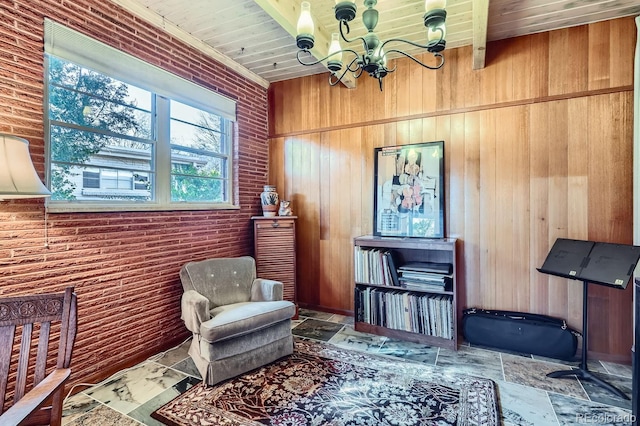 sitting room with brick wall, stone tile floors, wood ceiling, and a notable chandelier