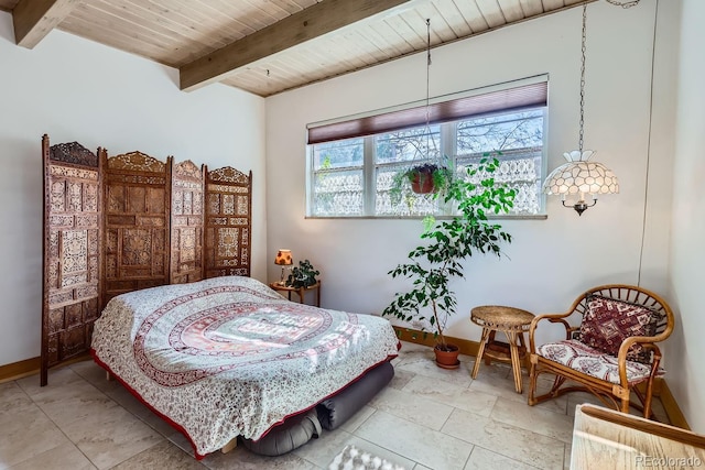 bedroom featuring wooden ceiling, beamed ceiling, and baseboards