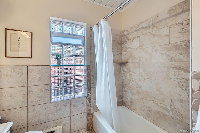 full bathroom with shower / bath combination with curtain and tile walls