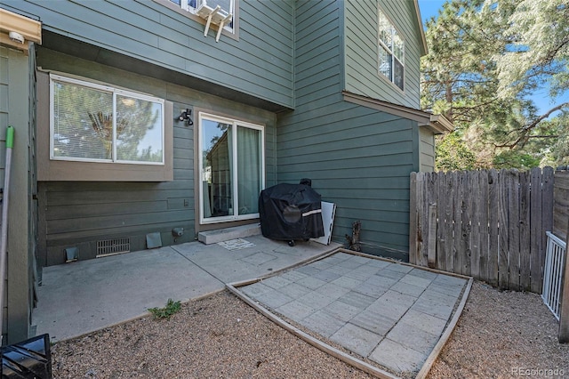 view of patio featuring a grill