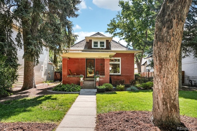 2360 S Milwaukee St, Denver, CO 80210 - bungalow with brick siding, a porch, and a shingled roof