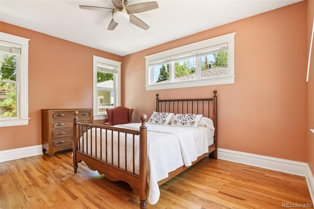2360 S Milwaukee St, Denver, CO 80210 - bedroom with multiple windows, light wood finished floors, and a ceiling fan
