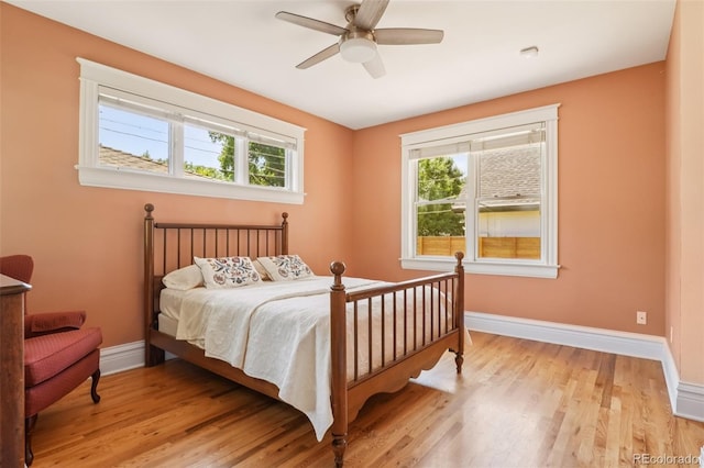 2360 S Milwaukee St, Denver, CO 80210 - bedroom with multiple windows, light wood finished floors, and ceiling fan