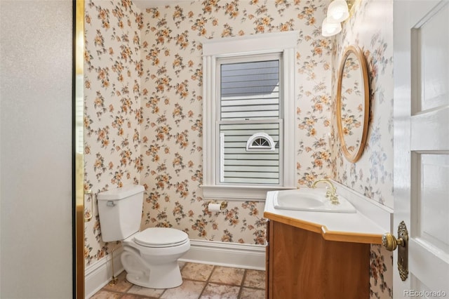 2360 S Milwaukee St, Denver, CO 80210 - half bathroom featuring wallpapered walls and vanity