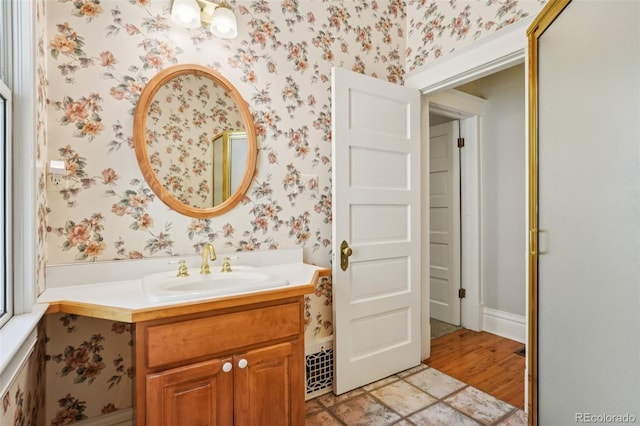 2360 S Milwaukee St, Denver, CO 80210 - bathroom with wallpapered walls and vanity
