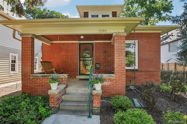 2360 S Milwaukee St, Denver, CO 80210 - entrance to property with covered porch and brick siding