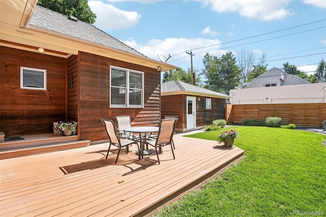 2360 S Milwaukee St, Denver, CO 80210 - wooden terrace featuring outdoor dining space and an outbuilding