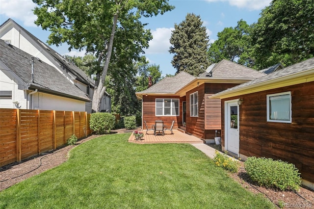2360 S Milwaukee St, Denver, CO 80210 - back of property with a wooden deck and a shingled roof
