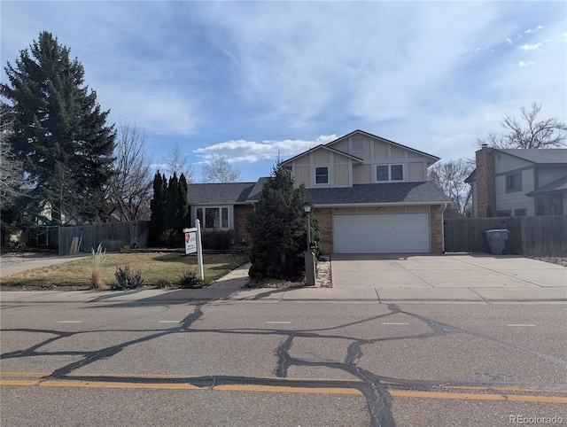2325 15th Ave, Longmont, CO 80503 - traditional-style home with fence, concrete driveway, a garage, brick siding, and a shingled roof
