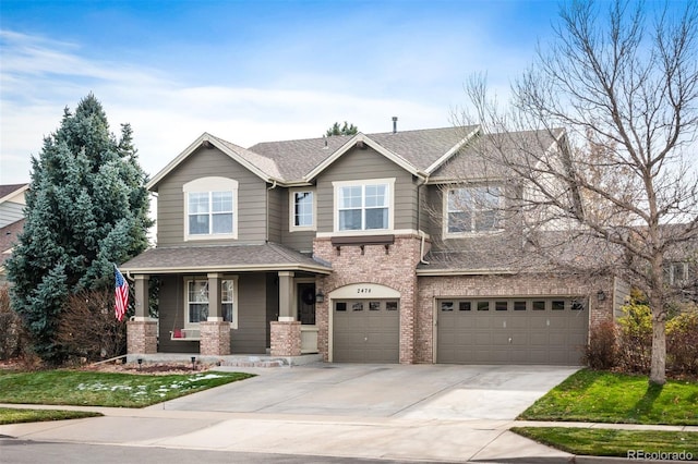 view of front of house with a porch and a garage