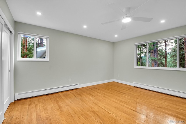 26752 Vosler St, Conifer, CO 80433 - empty room with a baseboard heating unit, light wood finished floors, plenty of natural light, and recessed lighting