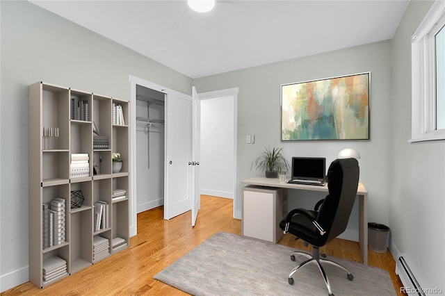 26752 Vosler St, Conifer, CO 80433 - office area with baseboard heating, wood finished floors, and baseboards