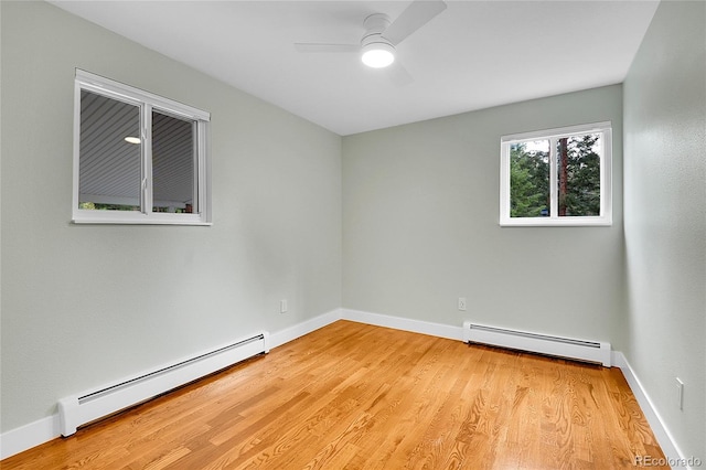 26752 Vosler St, Conifer, CO 80433 - empty room with a baseboard radiator, light wood-style floors, ceiling fan, and baseboards