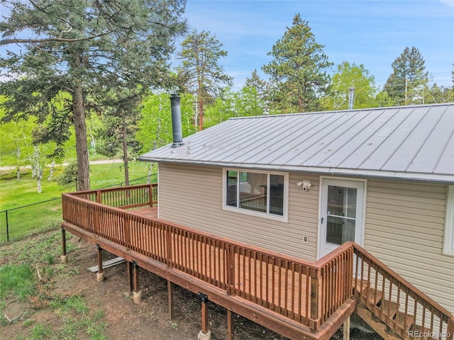 26752 Vosler St, Conifer, CO 80433 - rear view of house with a deck, metal roof, a standing seam roof, and view of wooded area