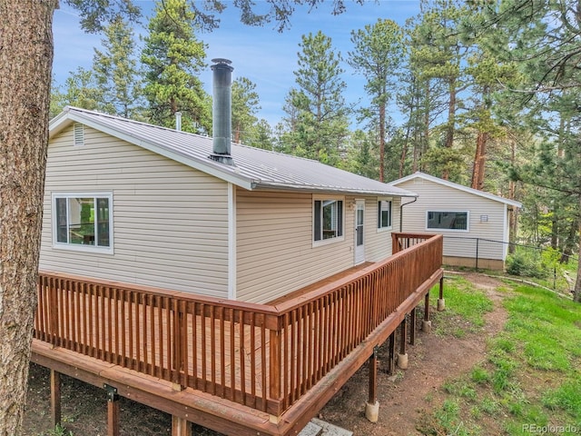 26752 Vosler St, Conifer, CO 80433 - rear view of house featuring a deck and metal roof