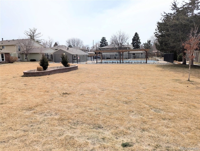 view of yard with a residential view and fence