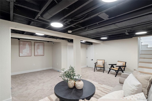 basement featuring light carpet