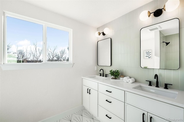 bathroom featuring tile patterned flooring and vanity