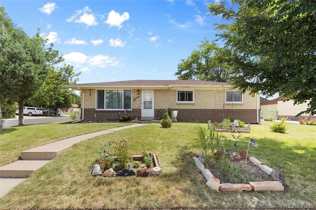 9830 E 5th Ave N, Aurora, CO 80010 - view of front of property featuring brick siding and a front yard