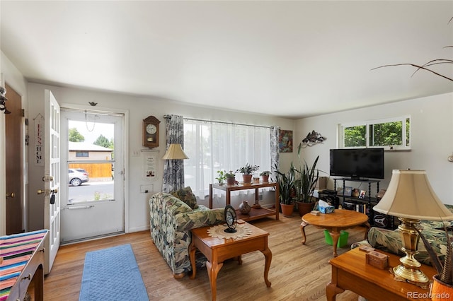 9830 E 5th Ave N, Aurora, CO 80010 - living area featuring light wood-style flooring