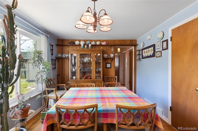 9830 E 5th Ave N, Aurora, CO 80010 - dining area featuring a chandelier and wood finished floors
