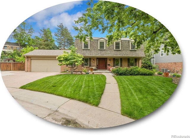 7030 S Fillmore Ct, Centennial, CO 80122 - front facade featuring concrete driveway, brick siding, an attached garage, covered porch, and roof with shingles