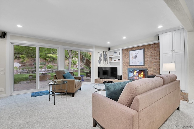 7030 S Fillmore Ct, Centennial, CO 80122 - living area featuring light colored carpet, plenty of natural light, recessed lighting, and a fireplace
