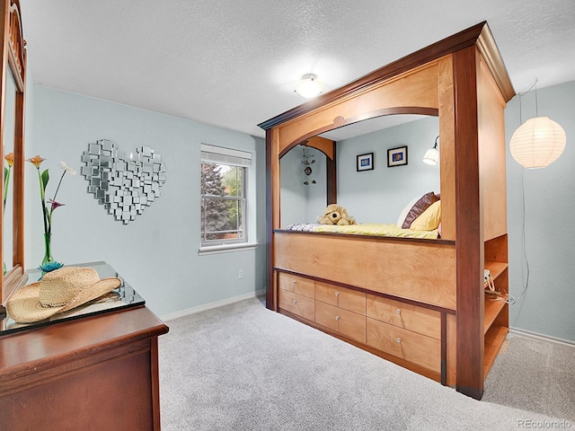 7030 S Fillmore Ct, Centennial, CO 80122 - carpeted bedroom with arched walkways, a textured ceiling, and baseboards