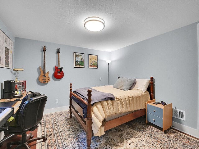 7030 S Fillmore Ct, Centennial, CO 80122 - bedroom featuring an office area and baseboards