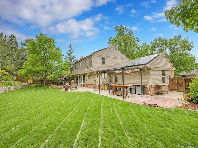 7030 S Fillmore Ct, Centennial, CO 80122 - back of property featuring a patio area, a gate, and solar panels