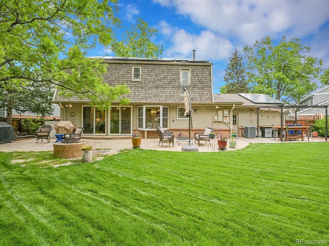 7030 S Fillmore Ct, Centennial, CO 80122 - back of property with a patio area, a yard, and cooling unit