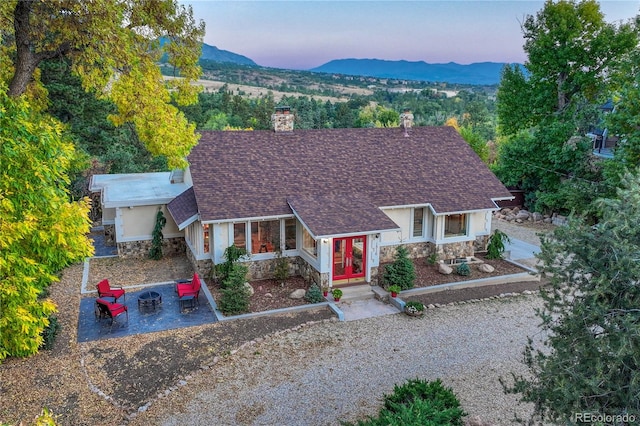 single story home with a mountain view and french doors