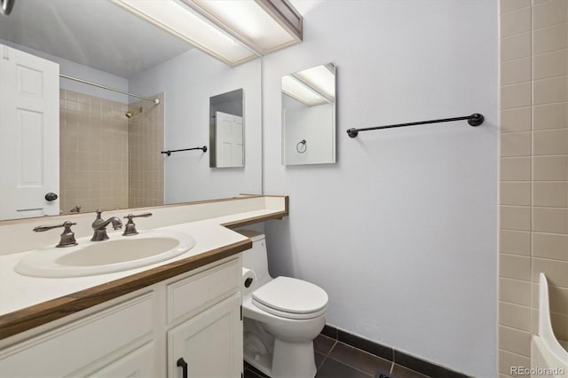 full bathroom with tile patterned floors, vanity, toilet, and tiled shower / bath combo