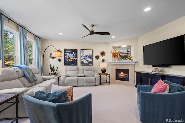 1113 Southbury Pl, Highlands Ranch, CO 80129 - living area with a tiled fireplace, ceiling fan, recessed lighting, and carpet