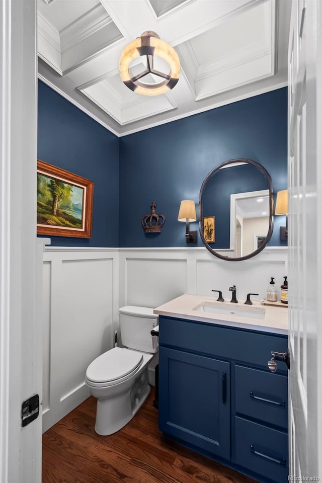 1113 Southbury Pl, Highlands Ranch, CO 80129 - bathroom featuring coffered ceiling, vanity, ornamental molding, a decorative wall, and toilet