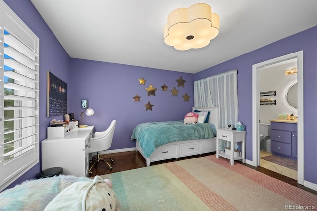 1113 Southbury Pl, Highlands Ranch, CO 80129 - bedroom with baseboards and connected bathroom