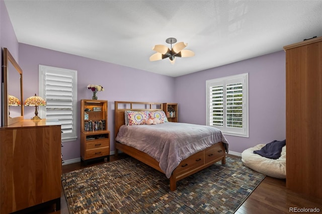 1113 Southbury Pl, Highlands Ranch, CO 80129 - bedroom featuring wood finished floors, ceiling fan, and baseboards