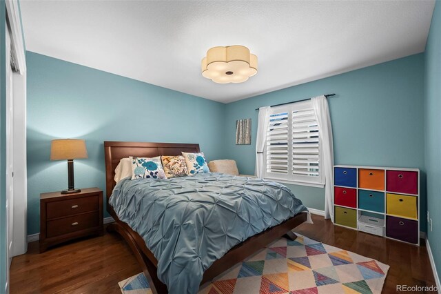 1113 Southbury Pl, Highlands Ranch, CO 80129 - bedroom with wood finished floors and baseboards