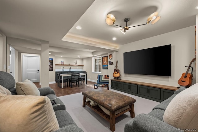 1113 Southbury Pl, Highlands Ranch, CO 80129 - living room with recessed lighting, bar with sink, wood finished floors, and baseboards