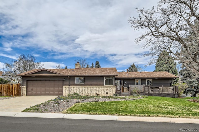 ranch-style home with driveway, a chimney, fence, an attached garage, and a front yard