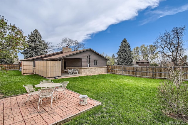 view of yard with a fenced backyard and a patio