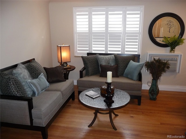 living room with baseboards and wood finished floors