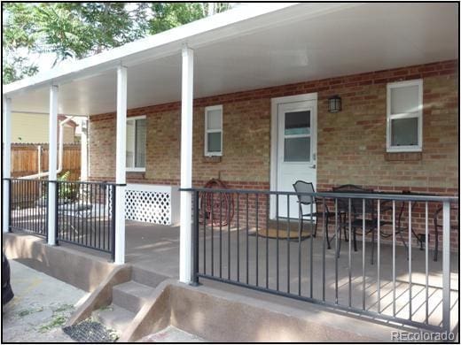 exterior space with brick siding